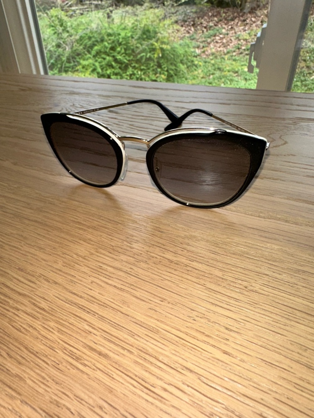 Prada Black Cat-Eye Sunglasses with Silver Accents